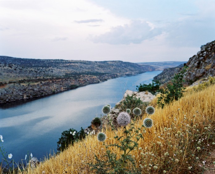 View on the reservoir lake of the Birecik Dam on the Euphrates river. As part of the Southeastern Anatolia Project, aka GAP, several dams were constructed in the area and surrounding regions as part of a larger agricultural and economic initiative by the Turkish Government. Turkey